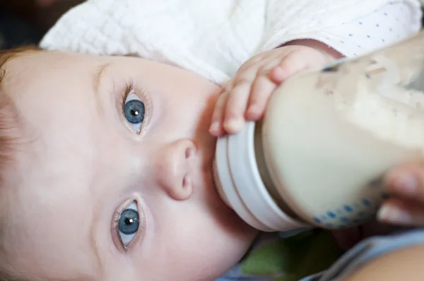 stock image Little girl eat milk