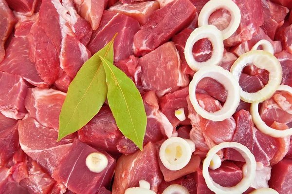 The texture of the meat, laurel leaf and onion — Stock Photo, Image