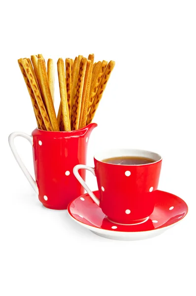 Varas de pão e café no utensílio vermelho — Fotografia de Stock
