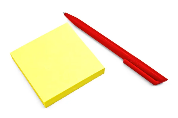 Желтая бумага с красной ручкой — стоковое фото