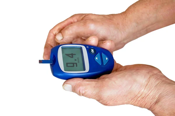 Glucometer in the hands of — Stock Photo, Image