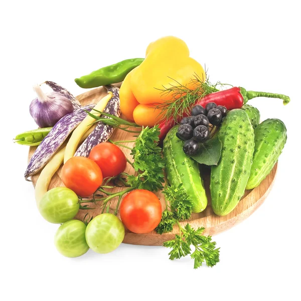 Vegetables on a round board — Stock Photo, Image