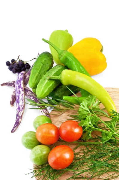 Grönsaker med en rund styrelse — Stockfoto