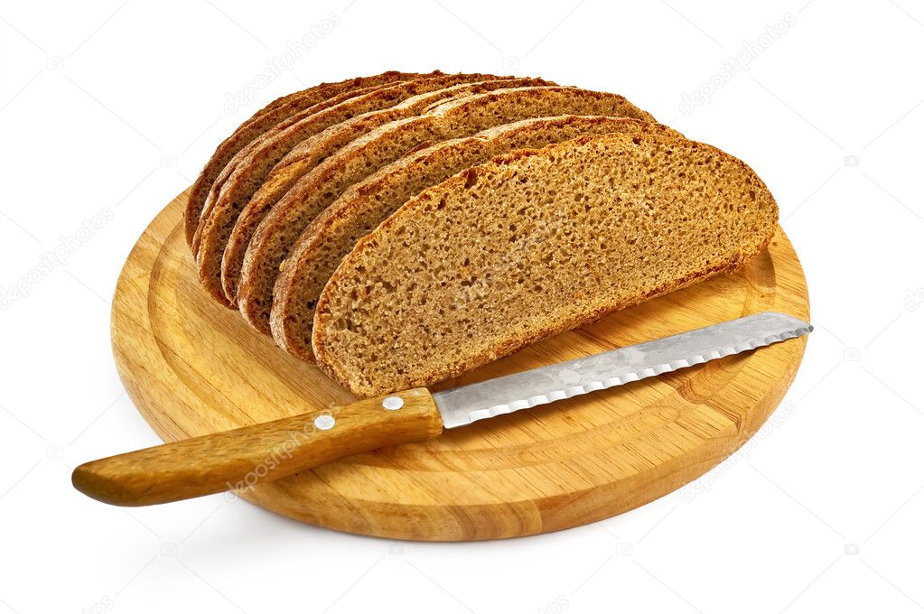 Rye bread on a round board with a knife