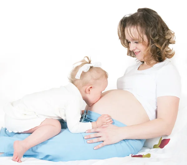 Child and pregnant mother — Stock Photo, Image