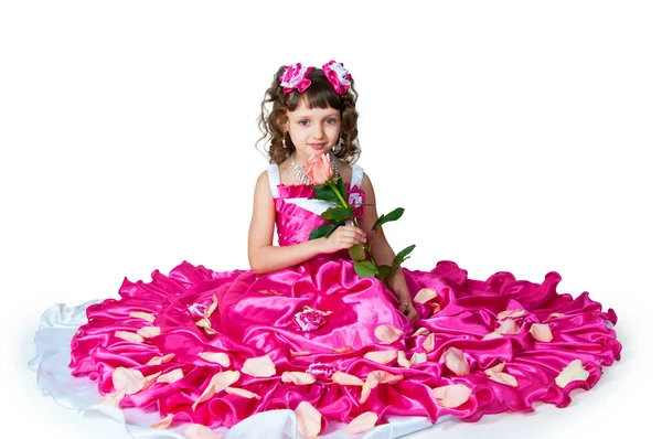 A menina em um belo vestido com rosa — Fotografia de Stock