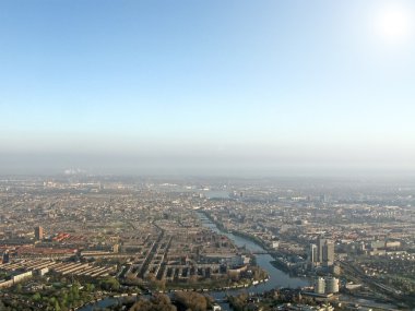 Bird eyes view on urban city, sun over buildings clipart