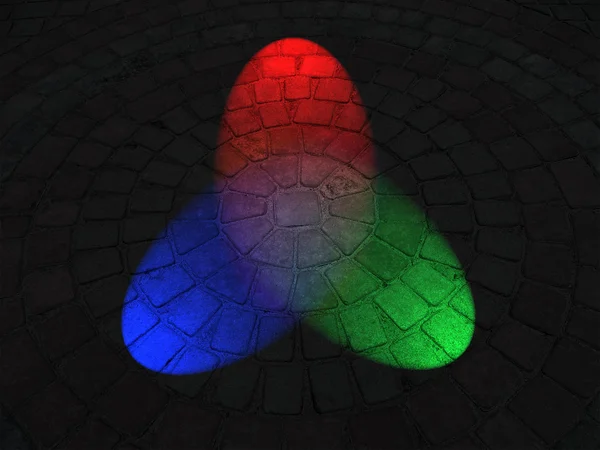 彩虹光照对圆的石头表面、 迪斯科行业. — 图库照片
