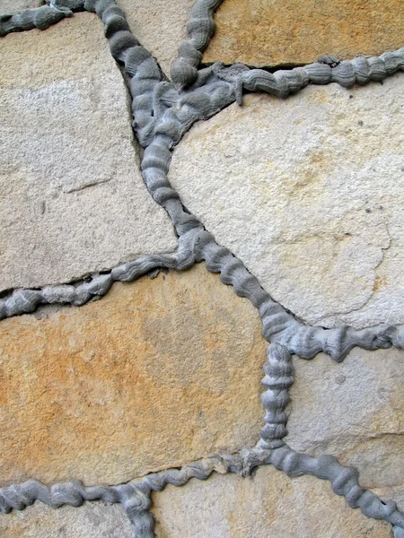 抽象的な石の壁が建設の詳細. — Stock fotografie