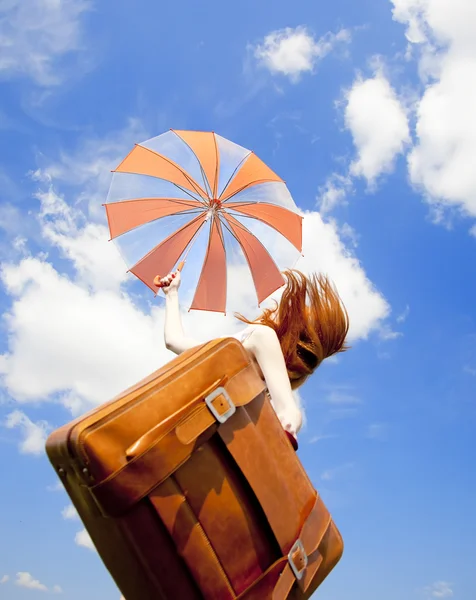 Redhead enchantress with suitcase jump in the sky. — Stock Photo, Image