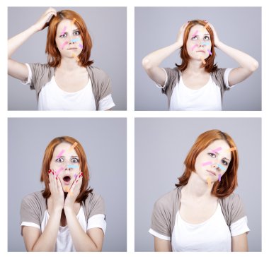 4 confused redhead businesswomen with notes on face. clipart