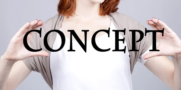 Redhead businesswoman show abstract word "concept". — Stock fotografie