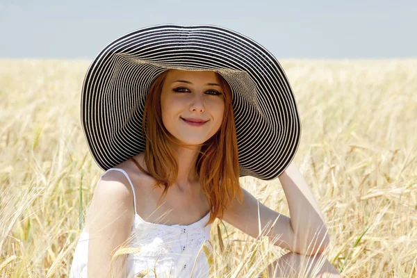 Redhead girl at spring wheat field. — Stock Photo, Image