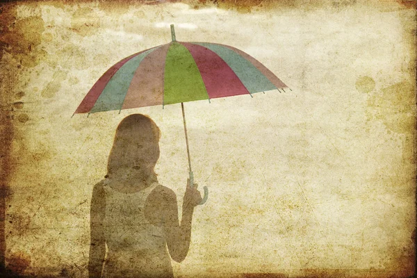 Girl with umbrella at sea coast. Photo in old image style. — Stock Photo, Image