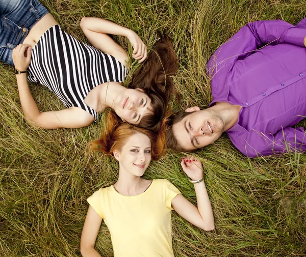 The students at green grass. — Stock Photo, Image