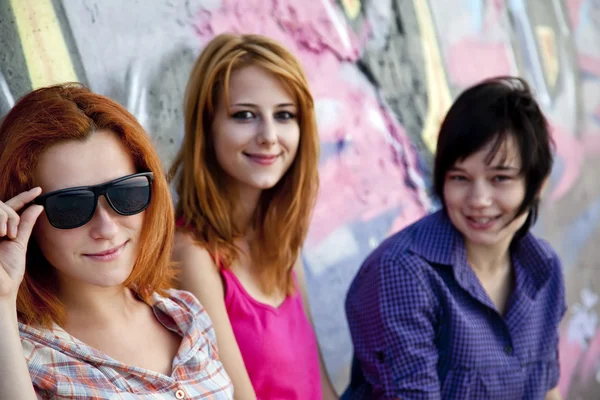 Girlfriends near graffiti wall. — Stock Photo, Image