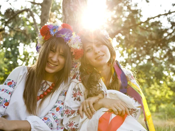 Two girls in national slavic costumes at outdoor. — Stock Photo, Image