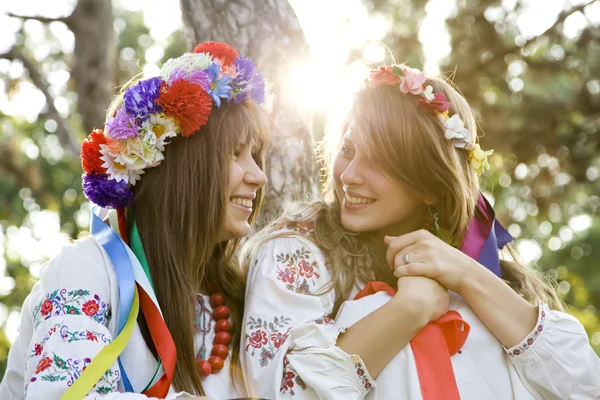 Two girls in national slavic costumes at outdoor. — Stock Photo, Image