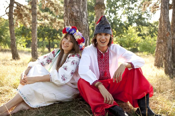 Slav girl with wreath and young cossack at nature — Stock Photo, Image