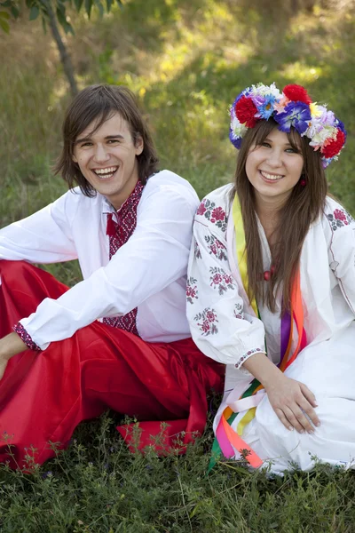 Slav girl with wreath and young cossack at nature — Stock Photo, Image