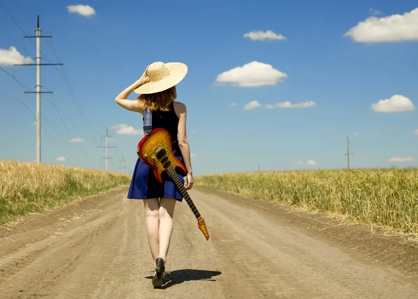 Rock girl with guitar at countryside. — Stock Photo, Image