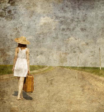 Lonely girl with suitcase at country road.. Photo in old image s clipart