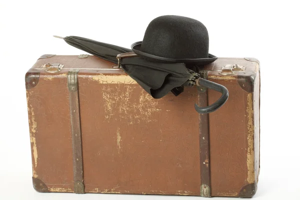 stock image Old suitcase, bowler hat and umbrella