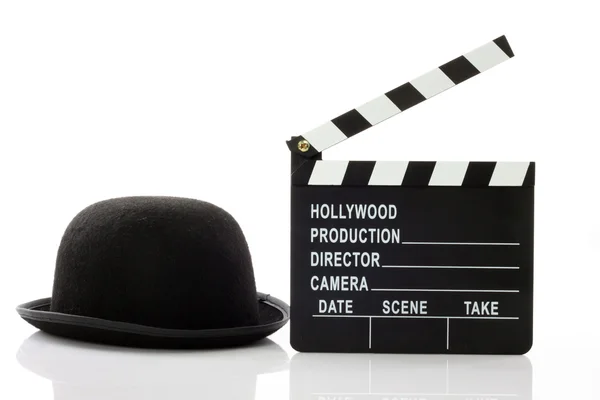 Bowler hat and movie clapper — Stock Photo, Image