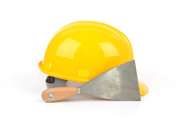 Žluté průmyslové bezpečnostní helmu a nerezové škrabky — Stock fotografie