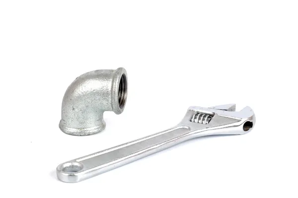 Adjustable Wrench tool and Malleable Iron Elbow 90° — 图库照片