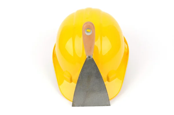 Žluté průmyslové bezpečnostní helmu a nerezové škrabky — Stock fotografie