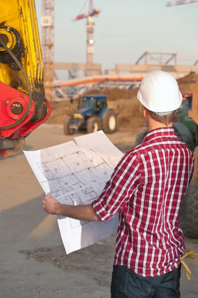 Architect working outdoors on a construction — Stock Photo, Image