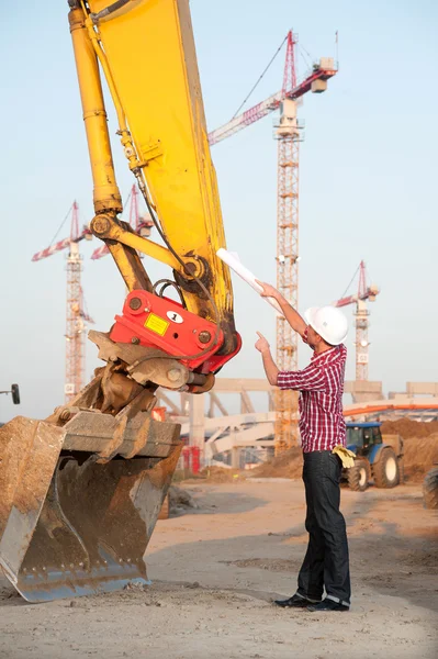 Stock image Architect working outdoors on a construction