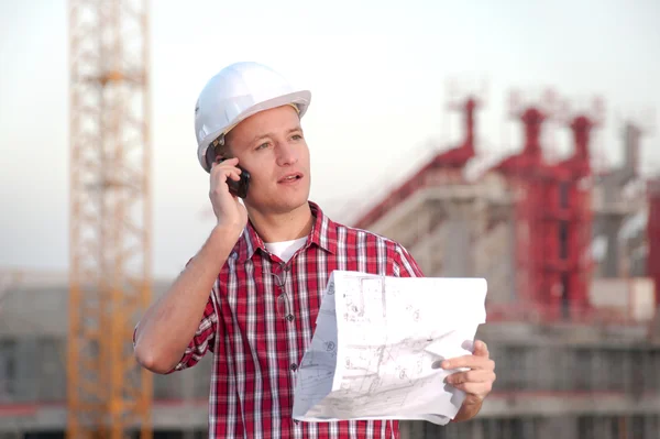 Architect working outdoors on a construction — Stock Photo, Image