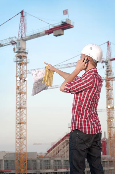 Architect working outdoors on a construction site — Stock Photo, Image