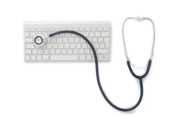 Stethoscop på en dator med tangentbord — Stockfoto