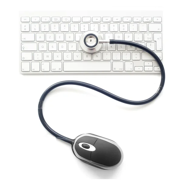 键盘的计算机上的 stethoscop — 图库照片