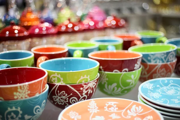 Stock image Colored plates and cups in the store