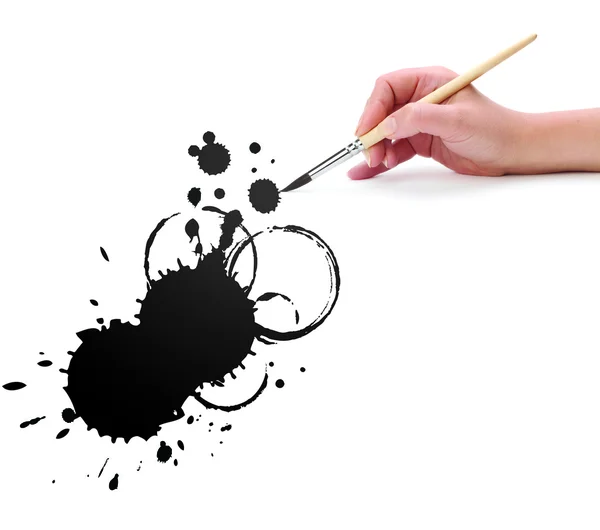 Hand with brush and abstract blot — Stock Photo, Image