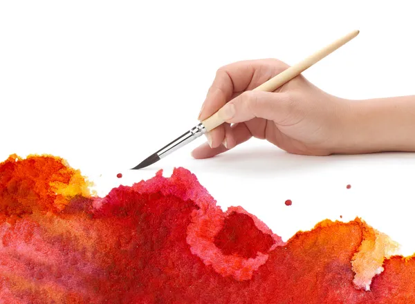 Hand with artist brush and abstract paint — Stock Photo, Image