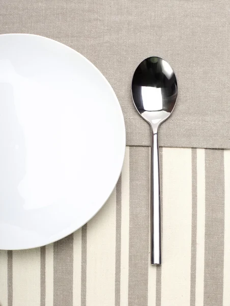 Spoon and plate — Stock Photo, Image