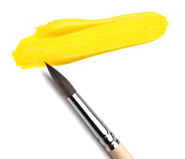 Pincel y dibujo de pintura amarilla — Foto de Stock