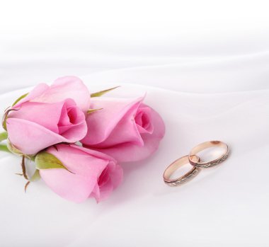 Wedding rings and roses