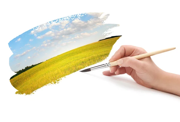stock image Hand with brush and landscape