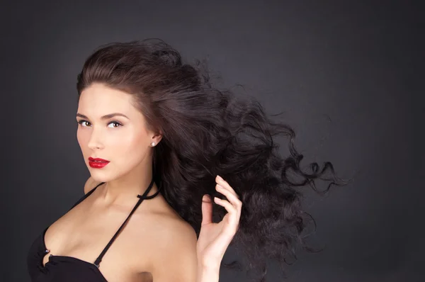 Brunette woman with her hair in movement — Stock Photo, Image