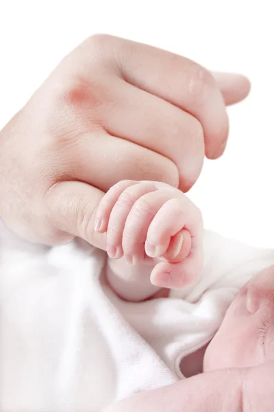 Baby holding fathers finger — Stockfoto