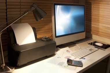 Office desk at night clipart