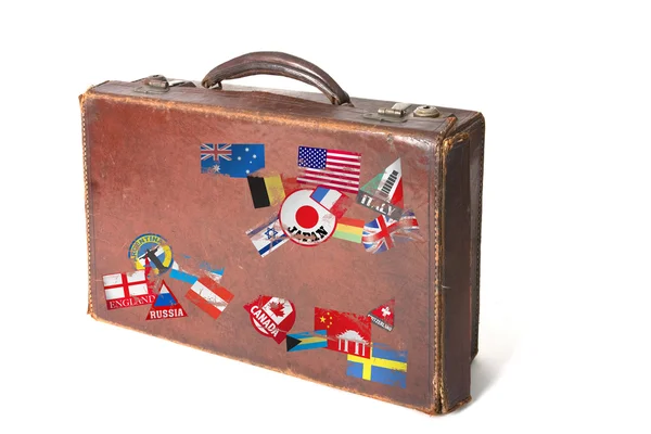 Koffer mit seltsamen Aufklebern und Briefmarken — Stockfoto