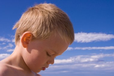 Young children playing on the beach clipart