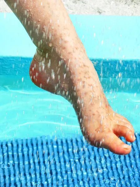 Foot on water. — Stock Photo, Image